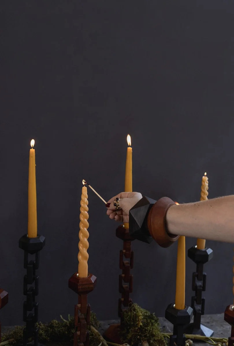 Janis Bangle in a candlelit setting